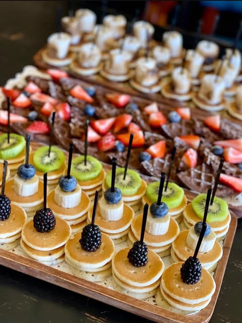 Fruit and sweet bites prepared by Sip & Graze Collective